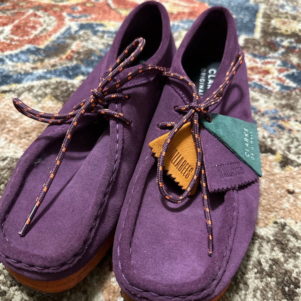 Women’s size 9 Wallabee’s in Purple and Orange.